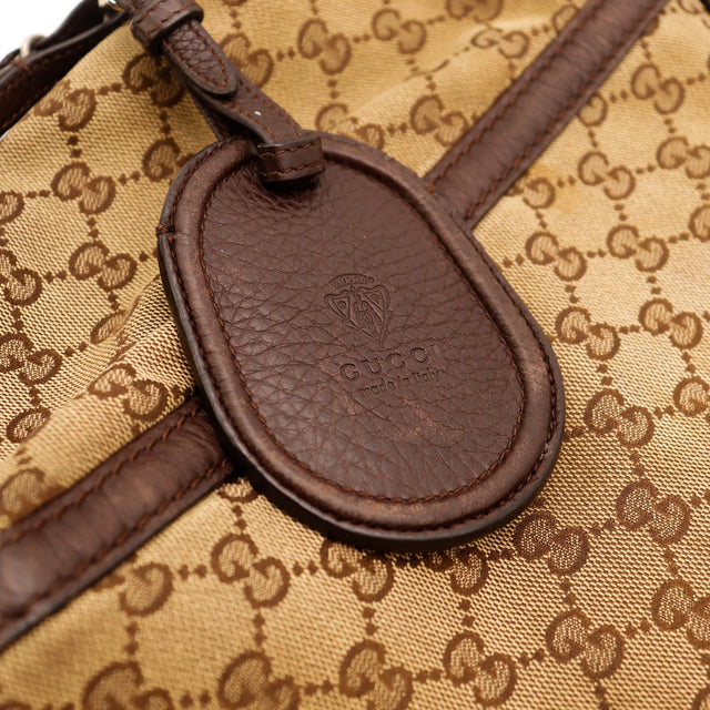 Détail breloque cuir estampée Gucci made in Italy — AMANA Vintage