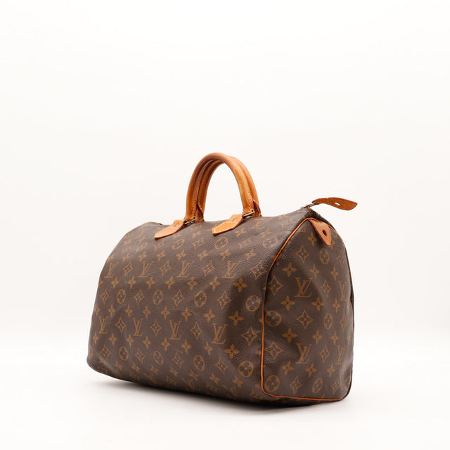 Vue trois quarts Louis Vuitton Speedy 35 toile Monogram patine caramel — AMANA Vintage