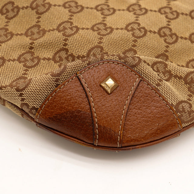 Détail coin cuir cognac et clou doré Gucci New Jackie — AMANA Vintage