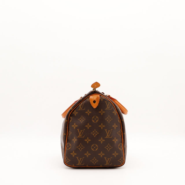 Vue de profil gauche Louis Vuitton Speedy 30 languette cadenas vachette — AMANA Vintage