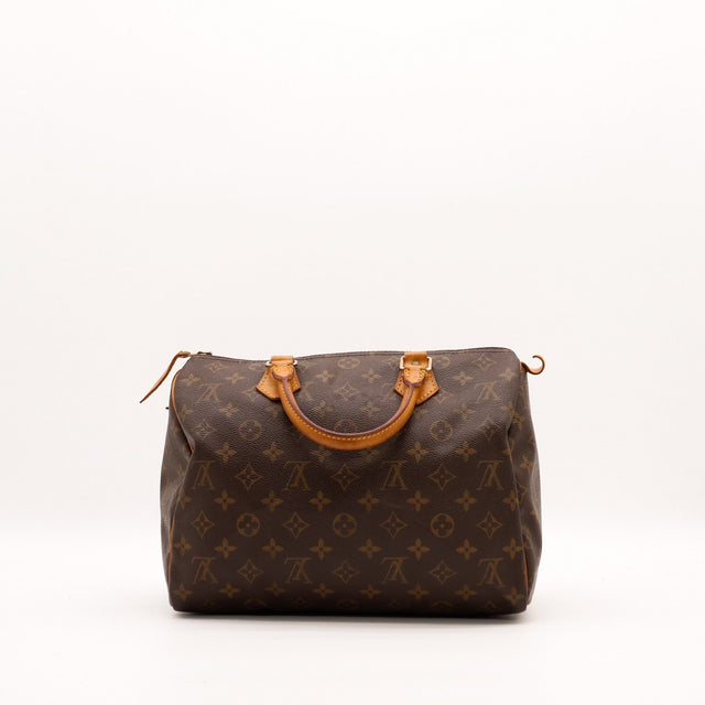 Vue de face Louis Vuitton Speedy 30 sac posé anses rabattues — AMANA Vintage