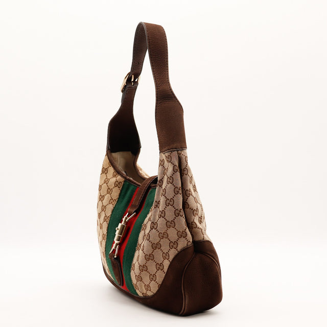 Vue de profil Gucci New Jackie toile monogrammée et nubuck marron occasion authentique — AMANA Vintage