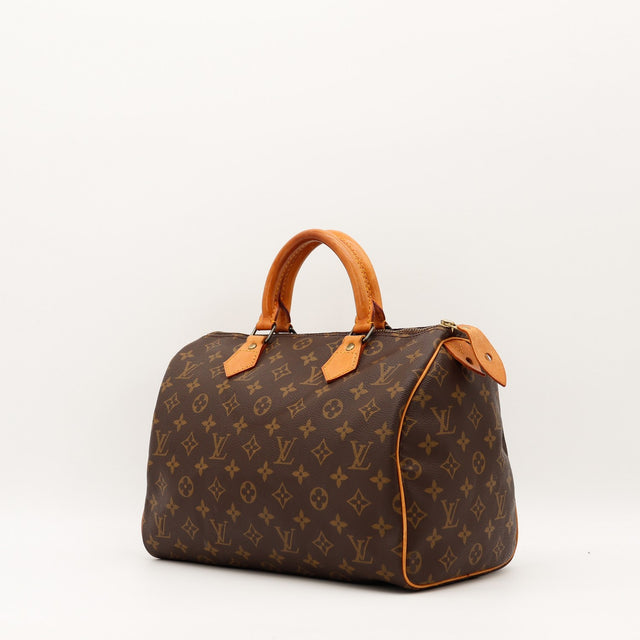 Sac Louis Vuitton Speedy 30 vue trois quarts cuir vachette patine caramel — AMANA Vintage