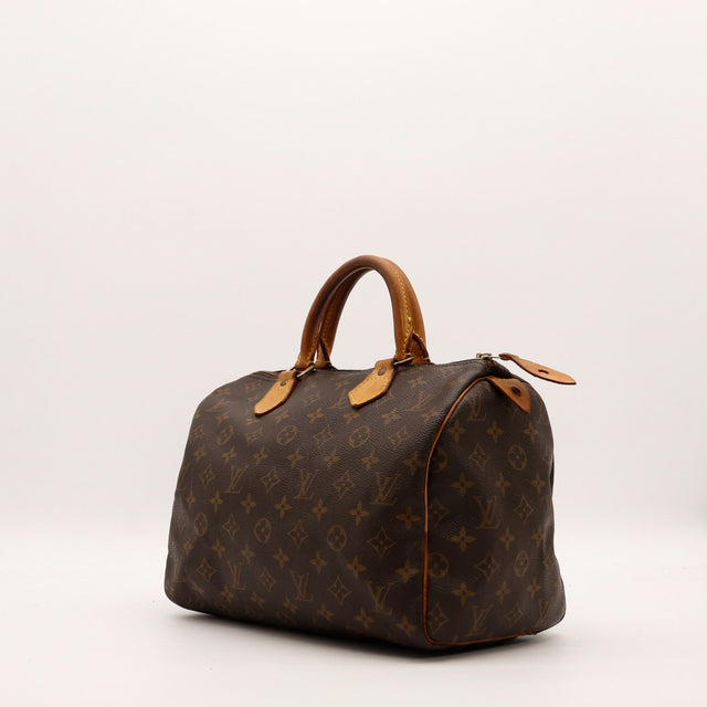Louis Vuitton Speedy 30 vue de trois quarts toile Monogram cuir vachette caramel — AMANA Vintage