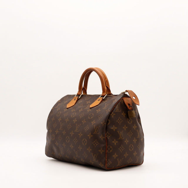 Louis Vuitton Speedy 30 vue trois quarts toile Monogramme patine caramel — AMANA Vintage