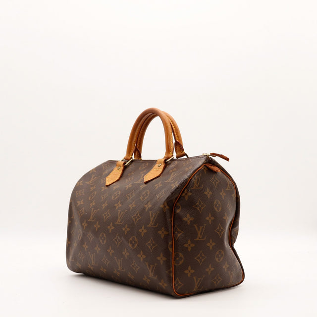 Louis Vuitton Speedy 30 vue trois quarts gauche toile monogramme patine caramel — AMANA Vintage