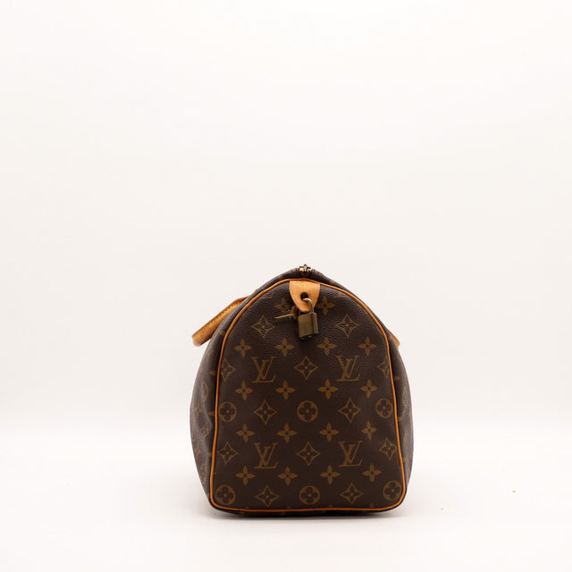 Vue de côté Louis Vuitton Speedy 35 toile Monogramme avec cadenas — AMANA Vintage