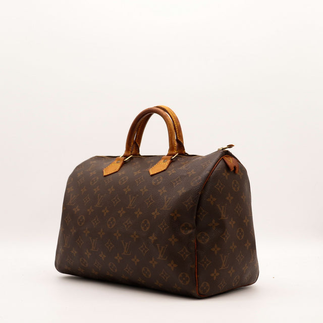 Louis Vuitton Speedy 35 vue trois quarts toile Monogram patine caramel — AMANA Vintage