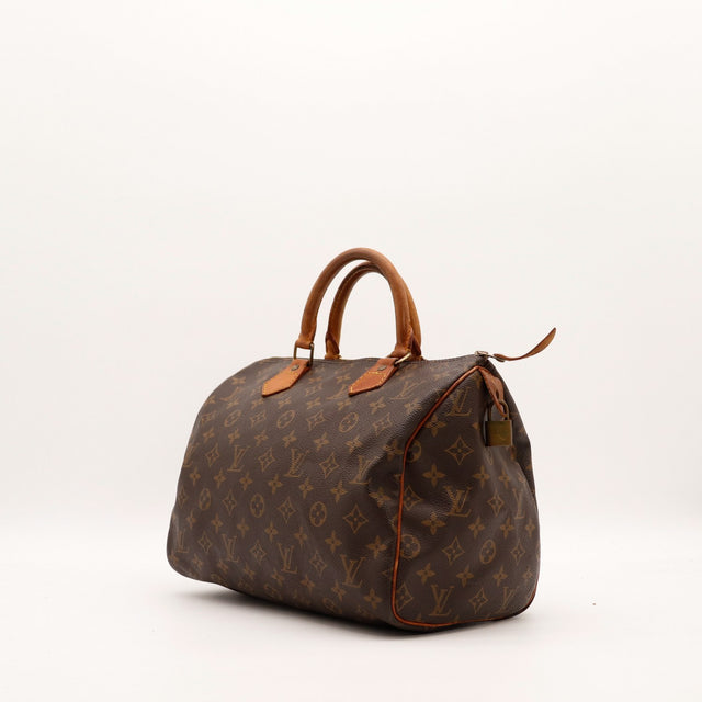 Vue de trois quarts Louis Vuitton Speedy 30 toile Monogram patine caramel — AMANA Vintage