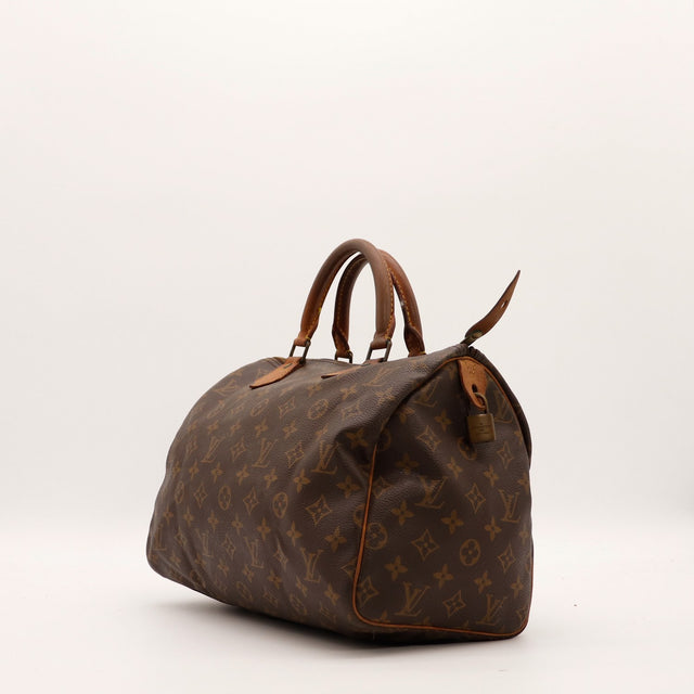 Vue de trois-quarts Louis Vuitton Speedy 30 toile Monogram marron — AMANA Vintage