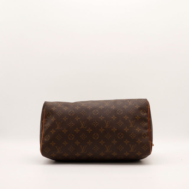 Vue trois quarts Louis Vuitton Speedy 35 anses et zip dorés — AMANA Vintage