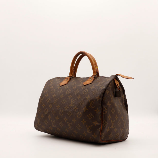 Vue de trois quarts Louis Vuitton Speedy 30 toile Monogram marron — AMANA Vintage