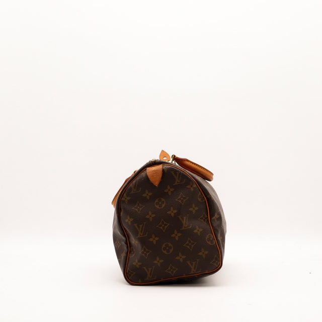 Vue de côté Louis Vuitton Speedy 30 tirette cuir vachette — AMANA Vintage