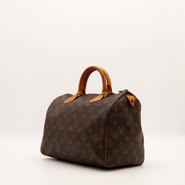 Louis Vuitton Speedy 30 vue trois quarts droite toile Monogramme patine caramel — AMANA Vintage