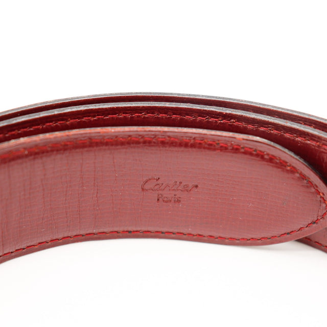 Détail cuir bordeaux estampille Cartier Paris ceinture réversible occasion authentique — AMANA Vintage