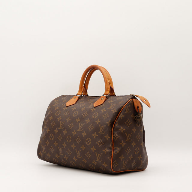 Sac Louis Vuitton Speedy 30 vue trois quarts cuir vachette patiné — AMANA Vintage