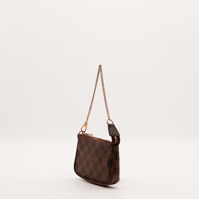 Vue de profil Pochette Accessoires Louis Vuitton Damier Ébène chaîne — AMANA Vintage