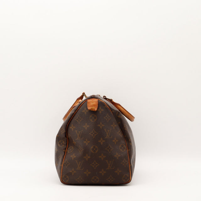 Sac Louis Vuitton Speedy 35 vue laterale cuir vachette patine caramel — AMANA Vintage
