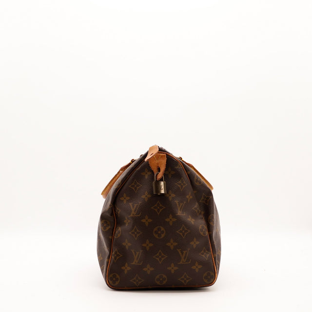 Vue de profil gauche Louis Vuitton Speedy 35 avec cadenas — AMANA Vintage