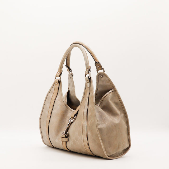 Sac Gucci Hobo doré vue de trois quarts occasion authentique — AMANA Vintage