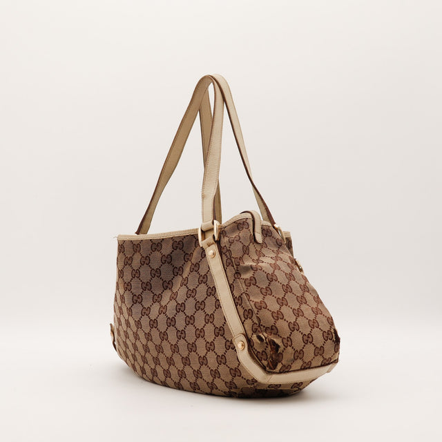 Sac Gucci Tote toile monogrammée vue latérale occasion authentique — AMANA Vintage