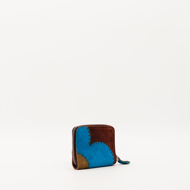 Portefeuille patchwork daim multicolore vue de trois quarts gauche détail zip — AMANA Vintage
