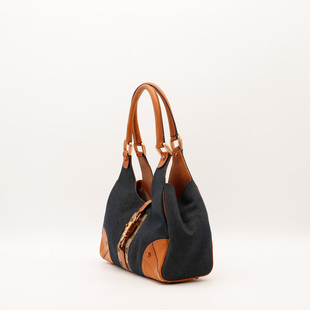 Détail fermoir piston doré Gucci Jackie denim occasion authentique — AMANA Vintage
