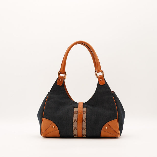 Détail cuir vachette patine Gucci Jackie denim occasion authentique — AMANA Vintage