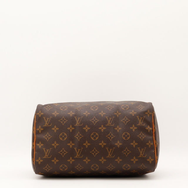 Vue de la patte de fermeture Louis Vuitton Speedy 30 Toile Monogramme occasion authentique — AMANA Vintage