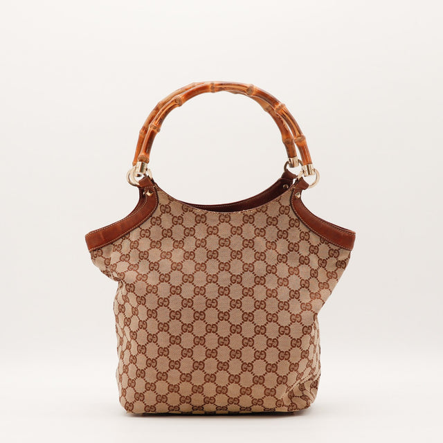 Détail coin inférieur toile effilochée Gucci Tote Bag Bambou occasion authentique — AMANA Vintage