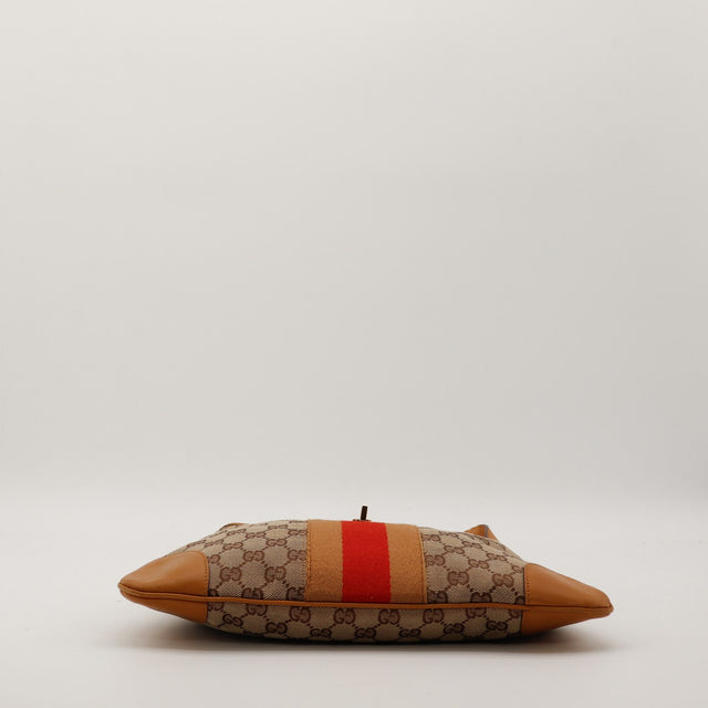 Détail fermoir piston doré Jackie Web Gucci occasion authentique — AMANA Vintage