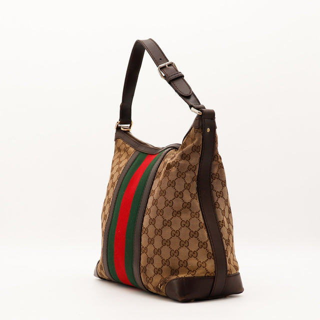 Gucci Hobo Web vue de trois quarts gauche toile GG Canvas bande Web occasion — AMANA Vintage