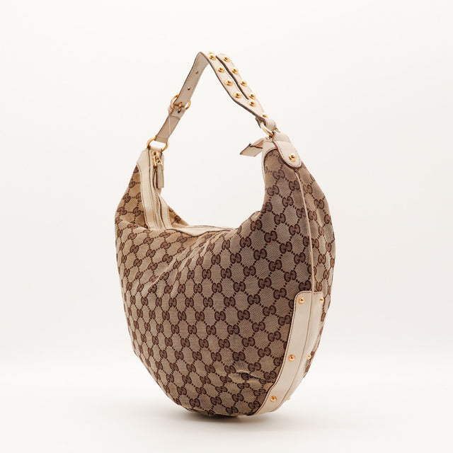 Détail anse cuir clair Gucci Hobo toile GG occasion authentique — AMANA Vintage