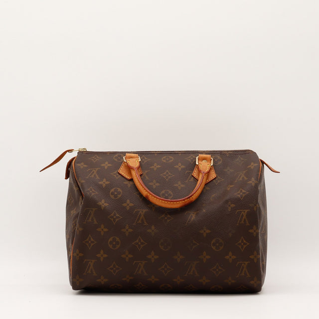 Détail de la tirette Louis Vuitton Speedy 25 Toile Monogramme occasion authentique — AMANA Vintage