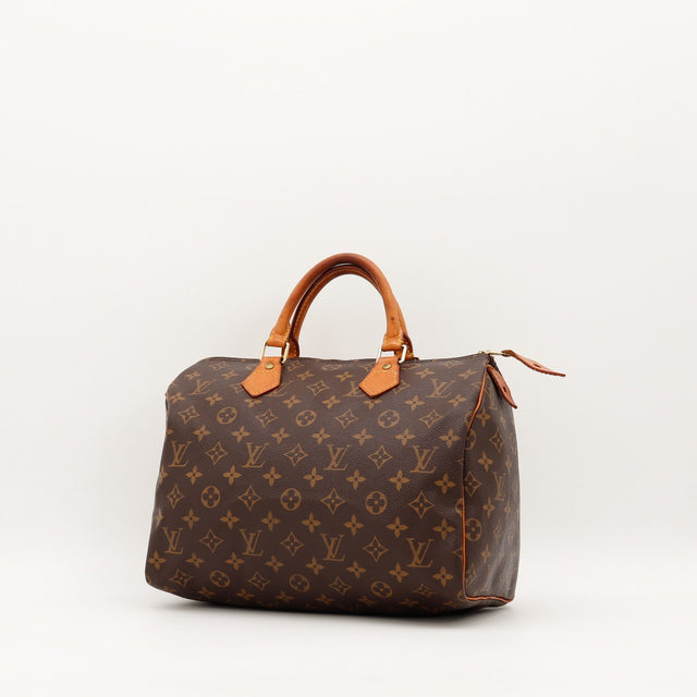 Louis Vuitton Speedy 30 vue trois quarts toile monogramme cuir vachette caramel — AMANA Vintage