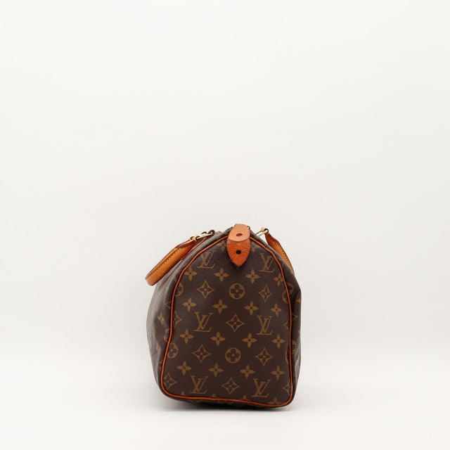 Vue de côté Louis Vuitton Speedy 30 profil languette cadenas vachette — AMANA Vintage