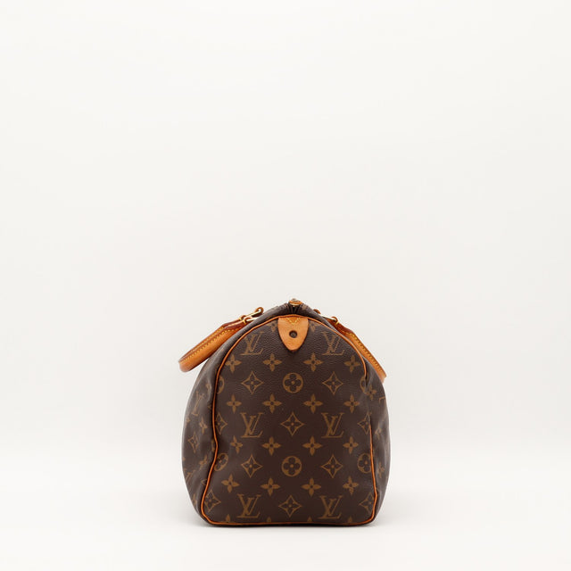 Louis Vuitton Speedy 30 vue de profil droit patine vachette caramel — AMANA Vintage