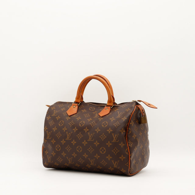 Louis Vuitton Speedy 30 vue trois quarts toile monogramme patine caramel — AMANA Vintage