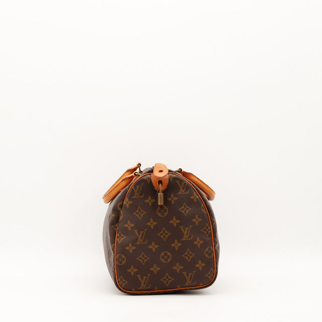 Vue latérale Louis Vuitton Speedy 30 avec cadenas et languette vachette — AMANA Vintage