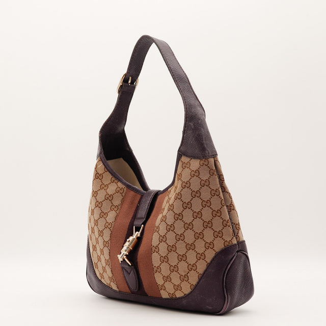 Détail fermoir piston doré Gucci Jackie toile monogrammée occasion authentique — AMANA Vintage