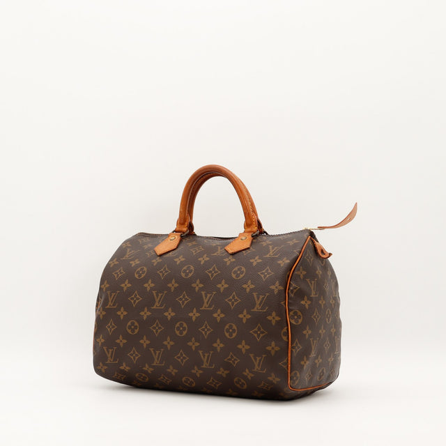 Louis Vuitton Speedy 30 vue trois quarts toile Monogramme patine caramel — AMANA Vintage