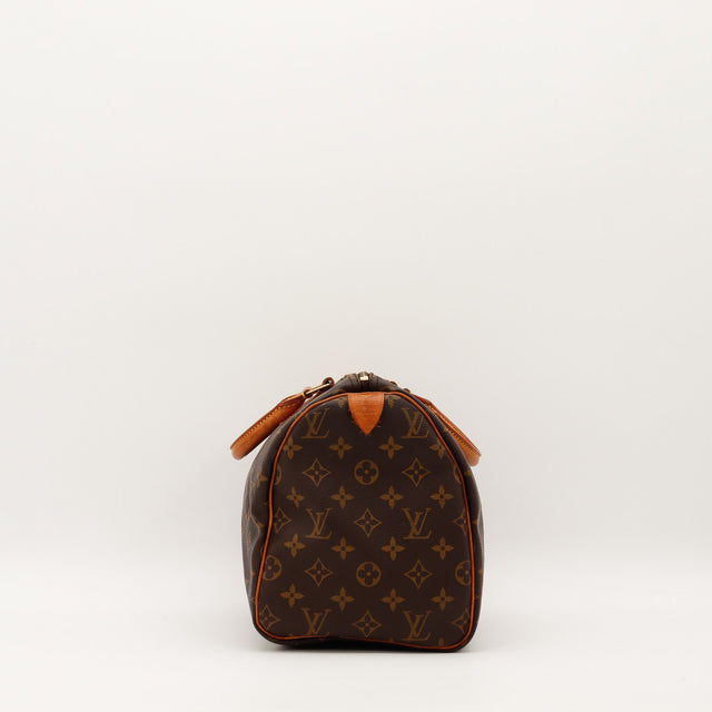 Vue de côté gauche Louis Vuitton Speedy 30 languette cadenas cuir vachette — AMANA Vintage