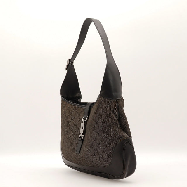 Détail fermoir piston argenté Gucci Jackie occasion authentique — AMANA Vintage