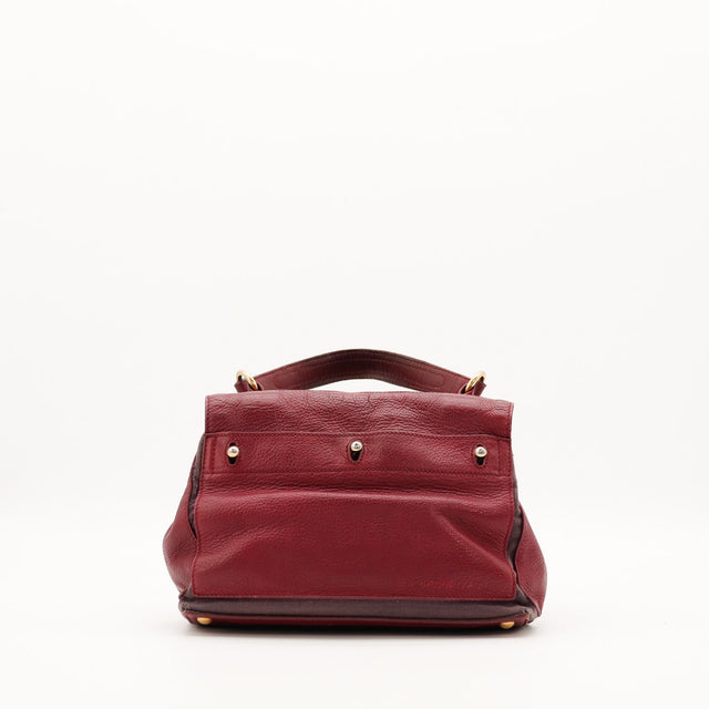 Vue de dos sac Yves Saint Laurent Muse bordeaux avec pieds dorés — AMANA Vintage