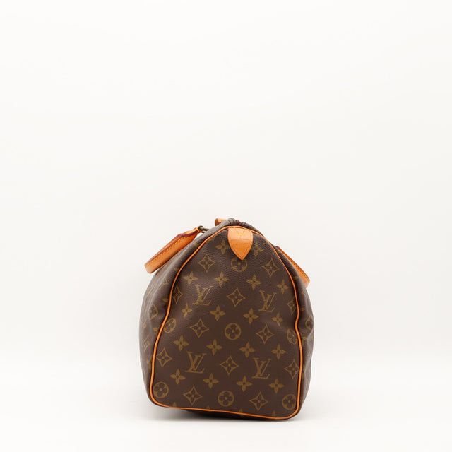 Vue de profil gauche Louis Vuitton Speedy 35 cuir vachette caramel — AMANA Vintage