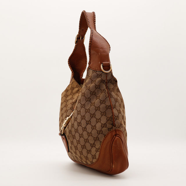 Sac Gucci New Jackie vue de profil gauche canvas GG cuir cognac — AMANA Vintage