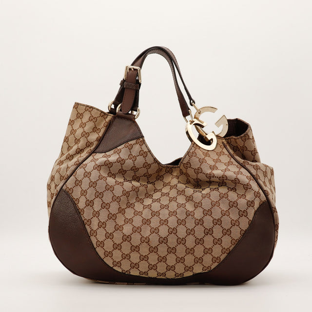 Sac Gucci Hobo Interlocking G vue de trois quarts droite toile monogramme occasion — AMANA Vintage