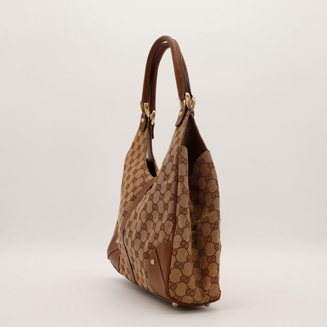 Sac Gucci New Jackie vue de trois quarts arriere canvas GG marron occasion — AMANA Vintage