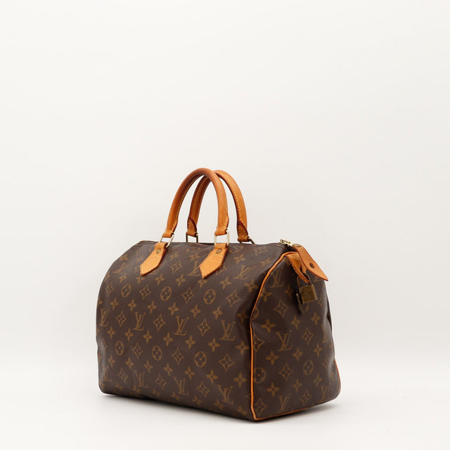Détail cuir vachette patine caramel Louis Vuitton Speedy 30 — AMANA Vintage