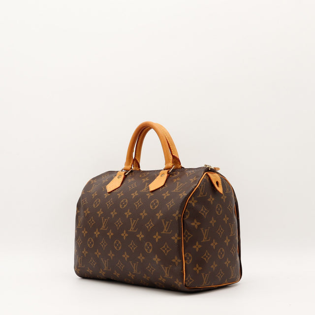 Détail cuir vachette patine caramel anses Louis Vuitton Speedy 30 — AMANA Vintage